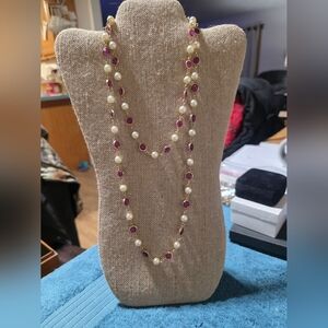 Twenty two inch, long pearl and pink crystal necklace.Gold tone beautiful